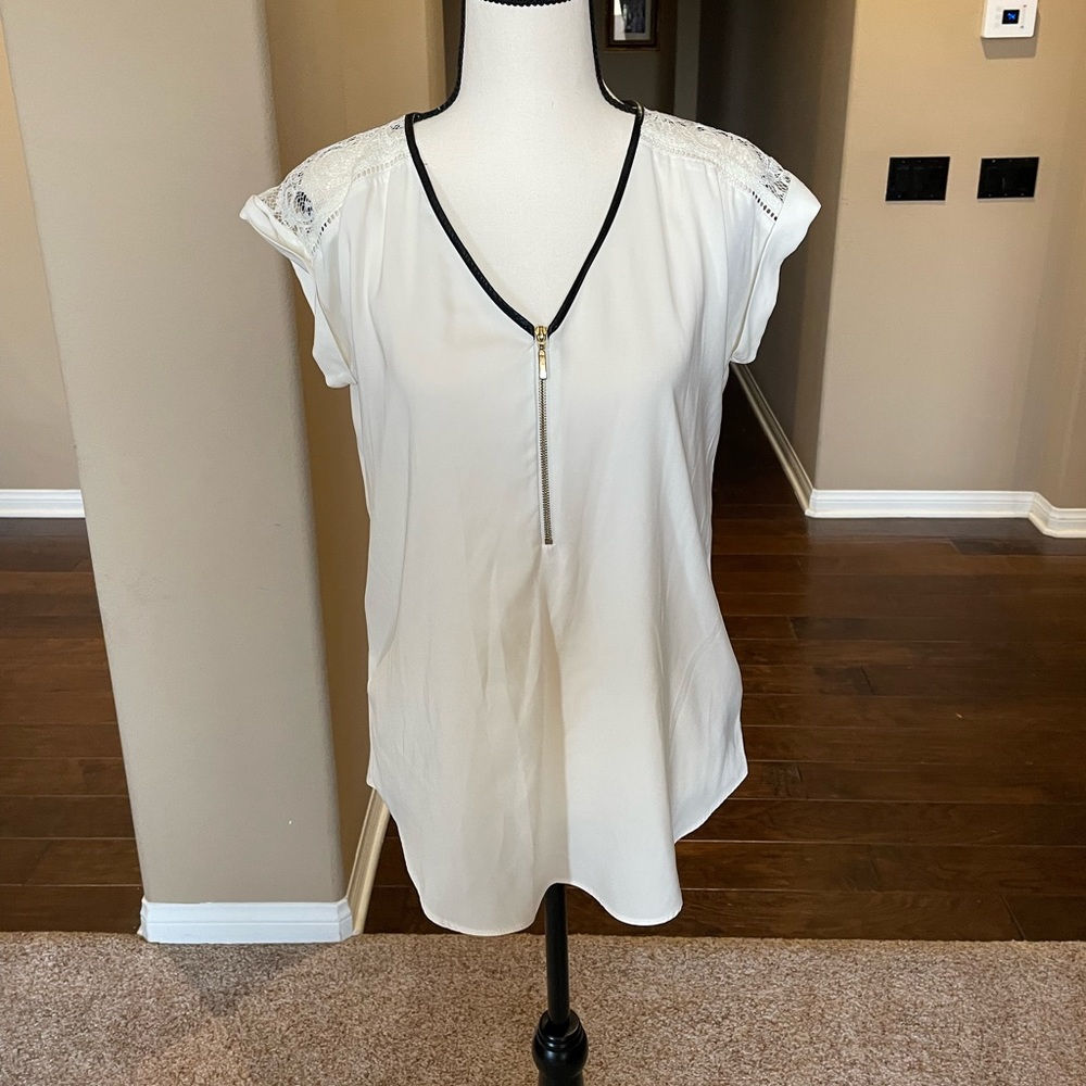 White silk blouse with lace over the shoulders and zipper down the front